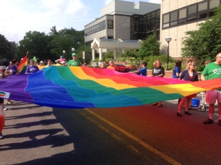 rainbow flag in 4th of July march